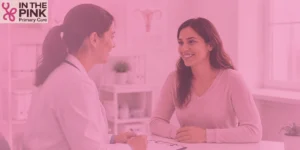 Woman discussing her health with a doctor during an annual wellness exam